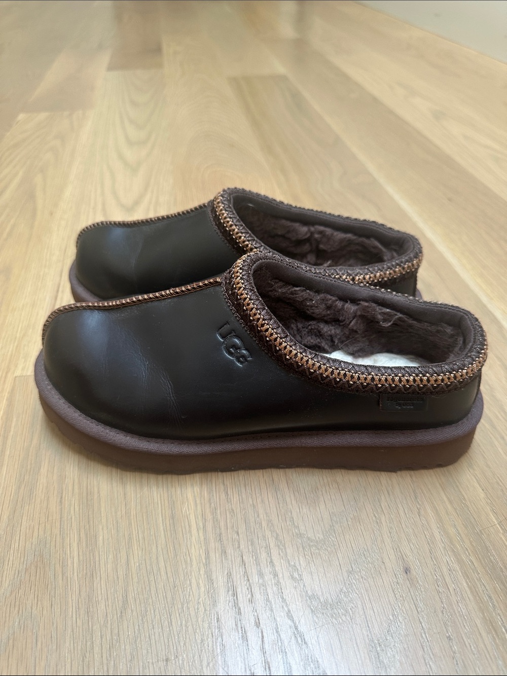 UGG women’s Dark Brown Shearling-Lined Slip-On Mules